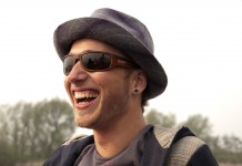 Satire is shaping the next generation laughing young man