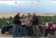 Vacation With Us… Miller Chuck and Tina Dazey, of Louisville, Ohio, and Gary and Linda Miller, of Hartville, Ohio, brought Farm and Dairy four-wheeling on the sand dunes of Lake Michigan for a week. After all the fun on the hills in the sand and mud, we had to empty our shoes!