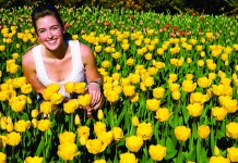 Optimism is good for your health woman in yellow flowers