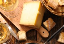 Seafood Cheese Fondue Dipping bread into the Seafood Cheese Fondue pot.