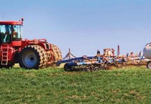 Gas compressor station could impact Pennsylvania farm Tractor working in field