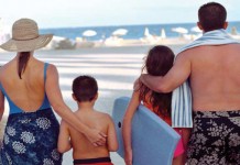 Hot weather health: How to treat and prevent heat stroke family at beach