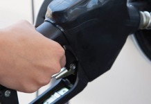 Increased oil and gas drilling leads to lower prices at the pump pumping gas