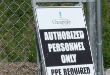Although oil and gas production is up, Chesapeake posts 3Q loss chesapeake well site sign