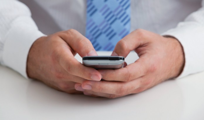 man holding cell phone