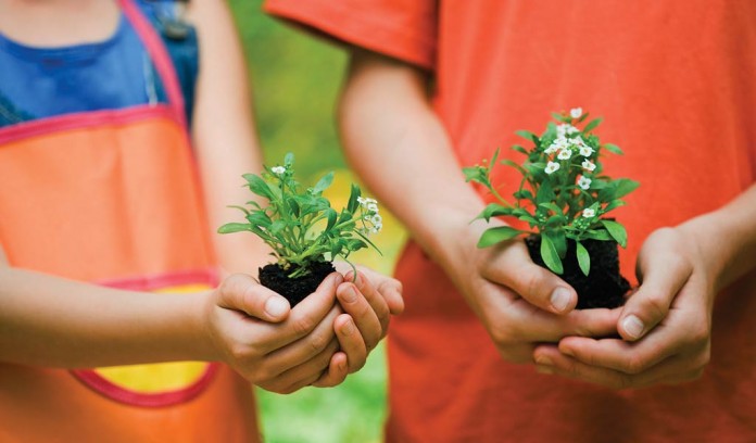 kids holding flowers