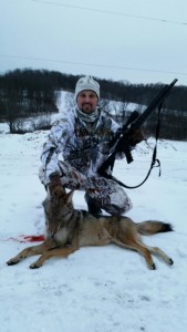 hunter with coyote