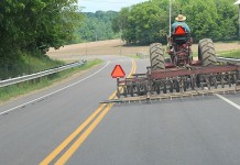 Slow Moving Vehicle sign saving lives for 50 years SMV signs in use