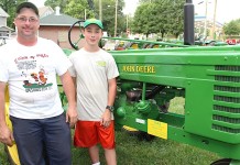 John Deere Expo features hundreds of tractors and stories Father and son with John Deere