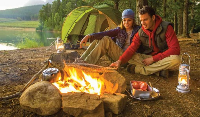 couple sitting by campfire