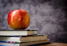 Ashland Cattlemen present awards apple on top of books