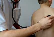 Scoliosis screening is key for young children Child and doctor