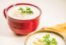 Warm yourself with soup Two bowls of potato soup sit waiting to be eaten.