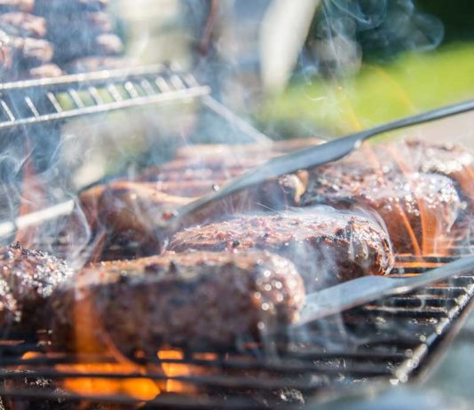 Grilling, Smoking, or Barbecuing: Is there a difference? Grill loaded with burgers