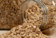 Chocolate Oat Bars Rolled oats in a jar spilled onto the counter.