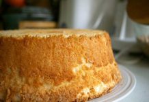 Angel Cake Angel Cake cooling on a plate after being removed from its pan.