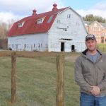 School farm is learning experience for New Lexington FFA John Lindsey, an FFA adviser at New Lexington, standing in front of school farm.
