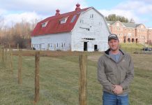 School farm is learning experience for New Lexington FFA John Lindsey, an FFA adviser at New Lexington, standing in front of school farm.