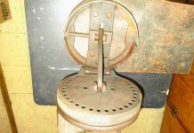 Can you name this Hazard a Guess Tool Submission? Richard Bader, of Middletown, New York, picked up Item No. 1125 at a yard sale. It is 9 inches in diameter, 6 1/2 inches in height when closed and weighs 12 pounds. There is a lever on the side that you can move to any hole on the disk. The peg on top has a handle and moves back and forth.