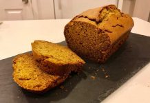 Pumpkin Bread Pumpkin Bread on a slate cutting board with slices.