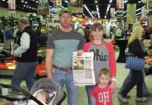 Visiting the National Farm Machinery Show with the Hays family The Hays family stands with their Farm and Dairy Newspaper at the National Farm Machinery Show