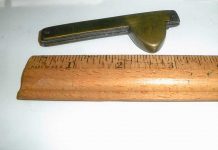 Can you name this golden-hued antique tool?