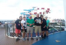 Cruising with the Swartz family and friends. The Swartz family and friends stand on the deck of their cruise ship with the waterslides in the background and a Farm and Dairy in their hands.