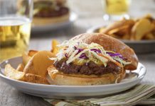 Carolina Barbecue Burgers Carolina Barbecue Burger on a plate with chips.