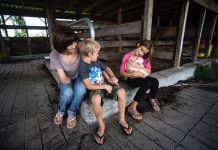 No arm, No problem. Farm accident survivor makes it work julie prentice with children