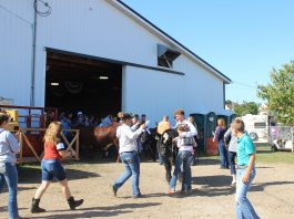 Friends and family congratulate Billy Kegley after he wins beef showman of showmen.