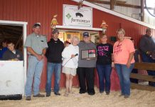 ‘A very blessed man’: Furlong wraps up lifetime of hog judging at Guernsey Co. Fair Darell Furlong stands with Ginny Barker and members of the hog committee after they recognized him with a plaque for his retirement.