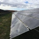 Here comes the sun: Farmers consider solar leasing solar panels in a field