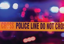 Wooster man arrested in Holmes Co. cattle thefts caution tape reading "police line do not cross."