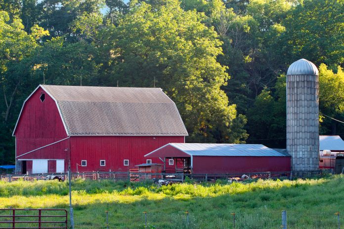 a red barn on a farm.