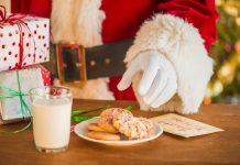 Santa’s Jelly Fingers Santa reaching for cookies on a plate with a glass of milk nearby