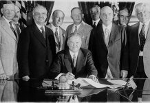 ‘Will the Dairy Cow Save Humanity?’ President Herbert Hoover signing the Farm Relief Bill in 1929.