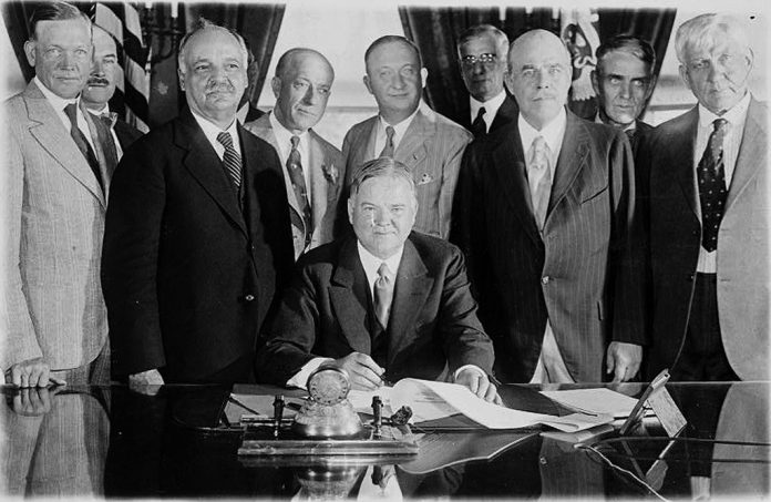 hoover-signing-farm-bill President Herbert Hoover signing the Farm Relief Bill in 1929.