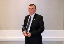 Kiko added to auctioneer’s hall of fame Russell Kiko holds his award.