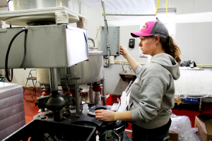 Kasey Baker adjusts the bottling machine in the on-farm milk plant at Baker's Golden Dairy in New Waterford, Ohio. 