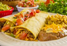 Beef Enchiladas for Two Beef Enchiladas with a side of refried beans and rice.