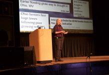 Experts advise ‘bounce forward’ on climate change A woman stands on a stage and speaks.