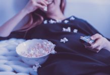 How to stay grounded (literally) woman eating popcorn