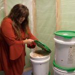 From corporate world to mushrooms: Canton resident builds new career in mushroom farming A woman lifts the lid on a bucket.