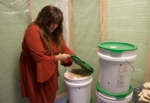 From corporate world to mushrooms: Canton resident builds new career in mushroom farming A woman lifts the lid on a bucket.