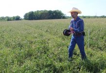 Keep pastures green during dry times guy reeling in fence