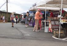 Pa. wants more farmers markets to accept food stamps Customers walk around stands at a farmers market.