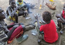 In the time of COVID, community isn’t just a word Sudanese children roast corn