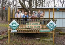 Brammer family aims to do it right with tree farm family stands on deck at tree farm