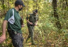 A 30-year investment: New ODNR wildlife officers get on-the-ground training Two wildlife officers walk through the woods.