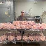 W.Va. FFA member wins national award guy with table full of turkeys